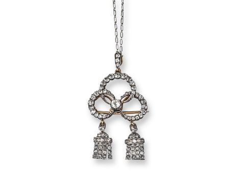 An early 20th century diamond set treffoil and tassel brooch pendant, centred with an old circular cut diamond with graduated