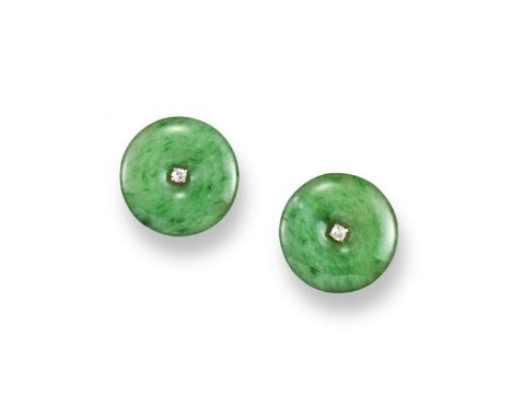 A pair of jade disc earrings, each circular disc is centred with a small diamond with gold mounts. The discs 1.7cm wide.