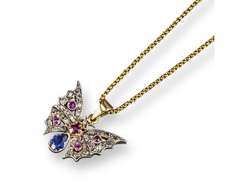 A small butterfly pendant, set with rose-cut diamonds, rubies and a pear-shaped sapphire in gold. On a fine-link antique gold