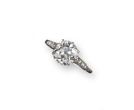 A diamond solitaire ring, the cushion-shaped diamond weighs approximately 2.35cts and is set in platinum and gold with smalle