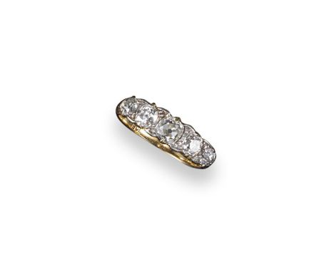 A diamond five stone ring, the graduated cushion-shaped diamonds are set in gold. Size L.