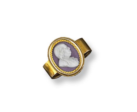 A 19th century gold scarf pin, mounted with an oval shaped Wedgwood mauve coloured portrait plaque, depicting the profile of 