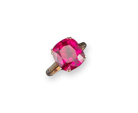 A cushion-shaped synthetic ruby mounted gold ring, size R.