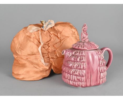 A Ye Daintee Ladyee Pink Glazed Teapot Together with an Early/Mid 20th Century Teapot Cosy in the Form of a Lady 