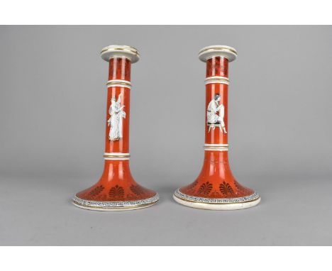 A Pair of Late 19th Century of Prattware Candlesticks Decorated with Classical Figures on Coral Red Ground, 21cm high (Condit