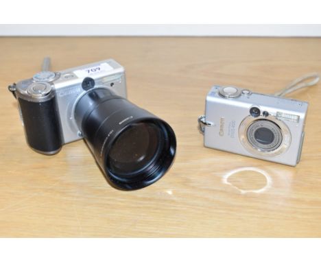 Two Canon digital cameras. A Canon Powershot A80 and an Ixus 400