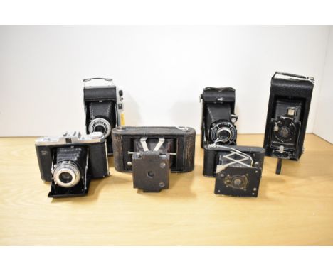 Six folding cameras. A Kodak No1 Folding Pocket camera Model B, a Kodak Junior I -kodette III, a Kodak Vest Pocket Special Au
