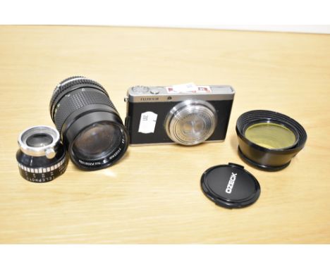 A Fujifilm digital camera with an Ozeck II Auto MC 1:2,8 135mm lens and Hammar telephoto lens