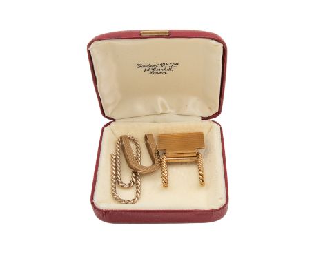Property of a Lady. A set of three money clips [a] A 9ct yellow gold engine turned and roped twist money clip [b] A 9ct yello