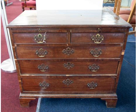 A Georgian mahogany bachelors chest fitted with a brushing slide over two short and three long drawers on bracket feet, width