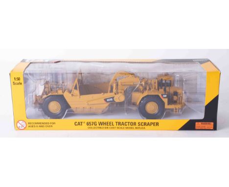 CAT 657G Wheel Tractor Scraper 1:50 scale, boxed.