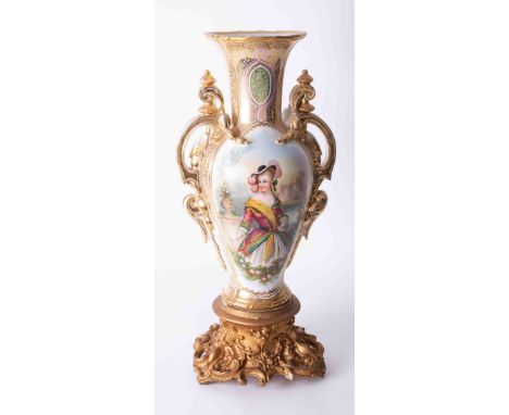 A large 19th Century French? porcelain ornate vase decorated with a panelled portrait of a classical lady on a carved and gil