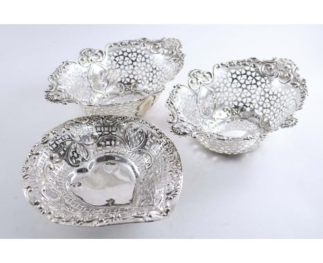 A PAIR OF EDWARDIAN BONBON DISHES of shaped opval outline by Haseler & Haseler, Chester 1905 and an Edwardian heart-shaped bo