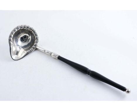 AN EARLY 20TH CENTURY DANISH PUNCH LADLE with a mounted turned ebony handle, the bowl chased around the edge with a border of