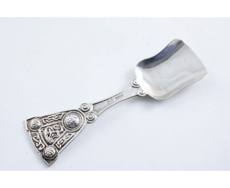 AN EARLY 20TH CENTURY SCOTTISH PROVINCIAL CADDY SPOON with Celtic bosses & interlaced ribbonwork in relief up the stem, by Al
