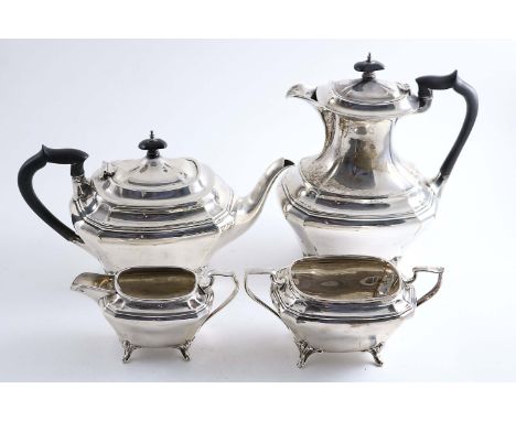 AN EARLY 20TH CENTURY FOUR-PIECE TEA SERVICE with shaped rectangular bodies and scroll feet, by J & W. Deakin, Sheffield 1922