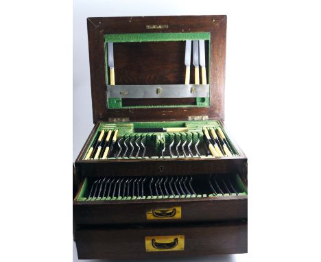 AN EARLY 20TH CENTURY PART CANTEEN OF HANOVERIAN PATTERN FLATWARE in a fitted oak canteen box with two drawers & a lift-up co