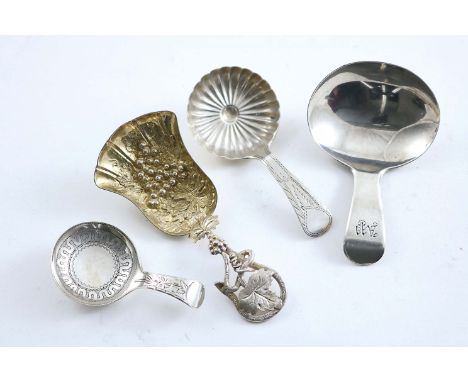 A VICTORIAN PARCELGILT CADDY SPOON with a leafy tendril stem & a fan-shaped bowl, by Hilliard & Thomason, Birmingham 1881 and