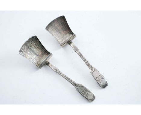A PAIR OF GEORGE III ENGRAVED CADDY SCOOPS crested, by William Pugh, Birmingham 1811;  4.5"  (11.5 cms) long;  0.9 oz (2)