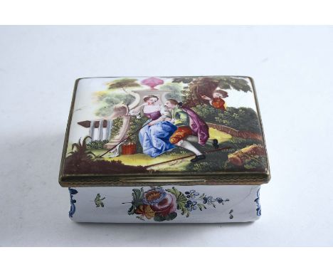 A LARGE STAFFORDSHIRE ENAMEL SNUFF BOX white painted with floral sprays, the cover with rustic lovers, gilt metal mounts;  9.