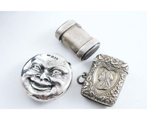 A CONTEMPORARY VESTA CASE cast with a sad face on one side and a happy face on the other, by David Bowles, London 1995, a Vic
