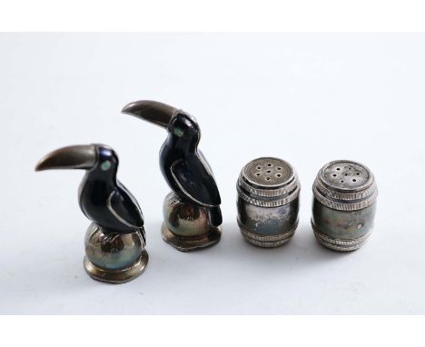A PAIR OF MID/LATE 20TH CENTURY DANISH ENAMELLED NOVELTY PEPPERETTES, each modelled as a toucan on a globe (one lacking its f