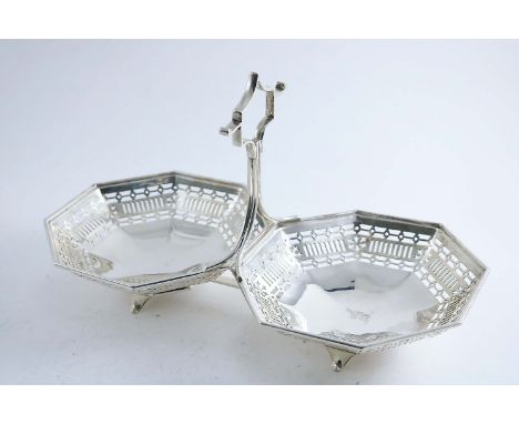AN EARLY 20TH CENTURY HORS-D'OEUVRE OR NUT DISH in the form of two conjoined octagonal dishes with piercing with a central ha