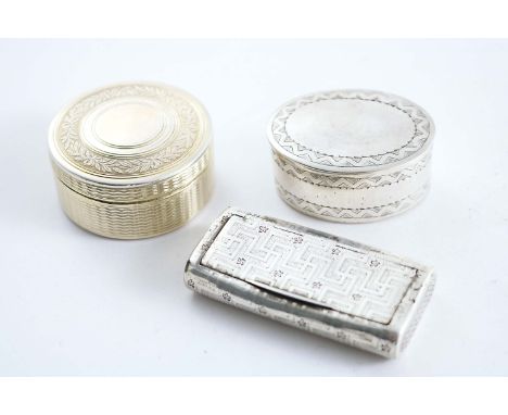 THREE BOXES:- A George III engraved snuff box, a late 19th century French silvergilt circular box & cover and another oval bo