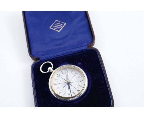 A VICTORIAN POCKET COMPASS with a suspensory ring, by John Tongue, Birmingham 1887 (in a fitted case);  1.9"  (4.7 cms) diame