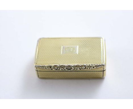 A GEORGE III RECTANGULAR SILVERGILT SNUFF BOX with engine-turned decoration and a raised floral thumbpiece, crested, maker's 