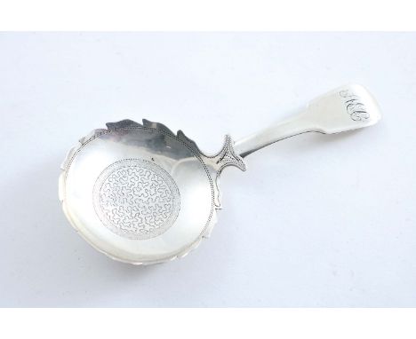 A GEORGE III FIDDLE PATTERN CADDY SPOON with a shaped circular bowl & pricked decoration, initialled, by Thomas Johnson, Lond