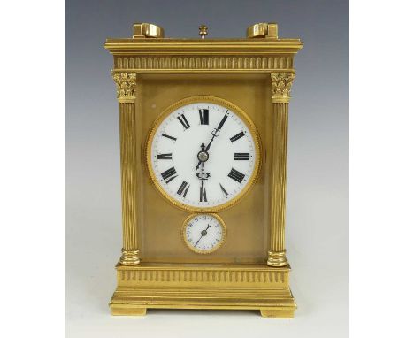 A late 19th century French lacquered brass carriage clock with alarm, the case having fluted Corinthian columns flanking whit