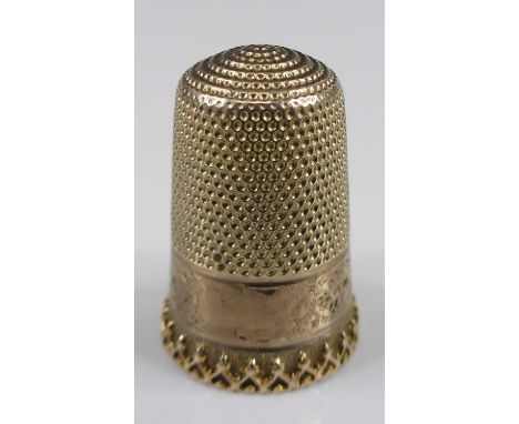 An engraved yellow metal thimble, unmarked but tests as 9ct gold, dia.15mm, gross weight 4.4g, within a fitted caseEngraving 