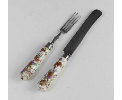 A Mennecy porcelain knife and fork, circa 1720-40, the cannon shafts gilt and enamel decorated with oriental flowers, knife l