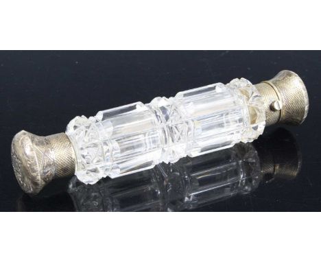 A Victorian double ended scent bottle, having a clear glass facet cut body with spring loaded hinged cover and screw cap to t