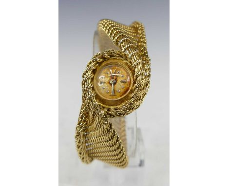 Jaeger LeCoultre for Kutchinsky, a lady's 18ct gold bracelet watch, having a signed silvered dial (badly discoloured) with ba