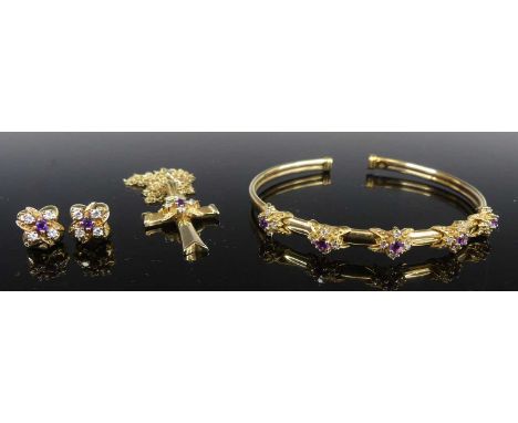 A 9ct yellow gold bangle, earrings and pendant suite, the torque style bangle set with five clusters of one 2.8mm purple and 