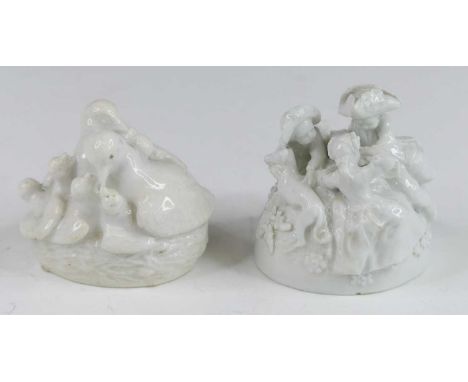 A Chelsea porcelain snuff box, circa 1754, in the form of a group of children playing with a dog, lacking mount and lid, h.6c