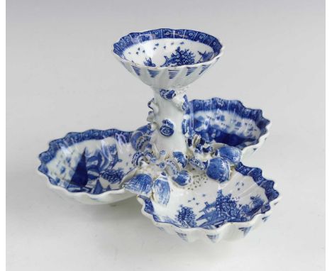 A Bow blue and white porcelain sweetmeat dish, circa 1755, the central rockwork column surrounded by three scallop shell dish