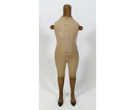 A late 19th century French carved wood and canvas child-size mannequin torso and legs, the feet with carved detail, stamped P