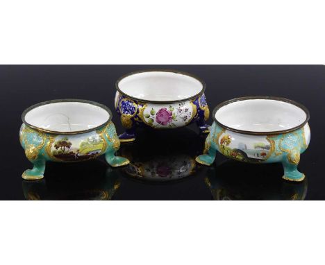 Three South Staffordshire enamel table salts, late 18th century, decorated with cartouches of landscapes and flowers upon blu