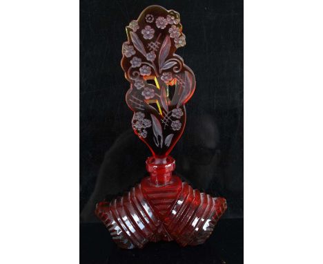 An Art Deco style Czechoslovakian red glass scent bottle, having a step shaped base, the stopper etched with leaves and flowe