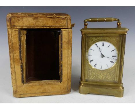 A late 19th century French lacquered brass carriage clock, the white enamel circular Roman dial within a Greek Key chapter ri