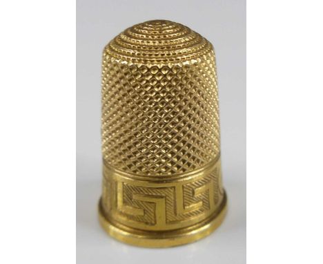 A Victorian yellow metal thimble, having a Greek key border and annotated reserve, unmarked but tests as 18ct gold, 5g