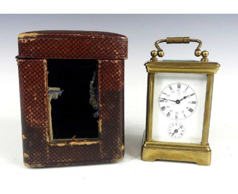 A late 19th century lacquered brass minuet carriage clock, having an unsigned white enamel Roman dial with inner Arabic 24-ho