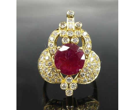 A yellow metal, ruby and diamond fancy openwork cluster ring, featuring a centre round faceted ruby within a surround of 52 r