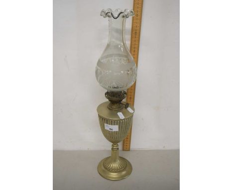 A silver plated oil lamp