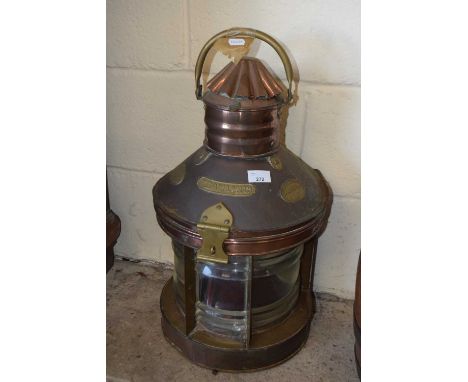A vintage copper and brass mounted ships light marked Trawling, lacking any interior fittings