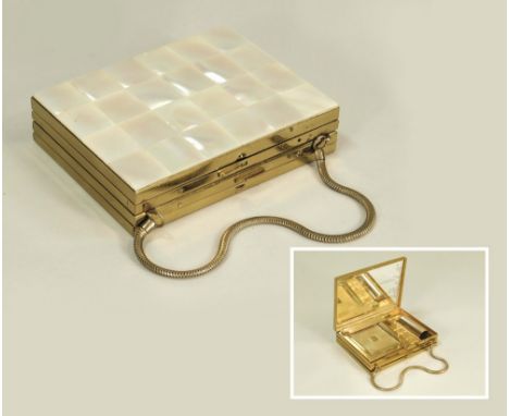 MINAUDERIE.A 1950's gold tone & mother of pearl minauderie with powder compact, lipstick & comb compartment to one side. The 