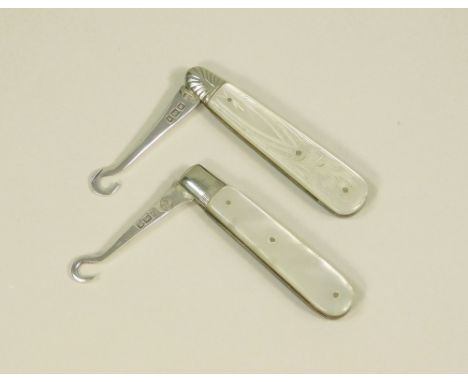 BUTTON HOOKS. Two button or glove hooks in silver &amp; mother of pearl.